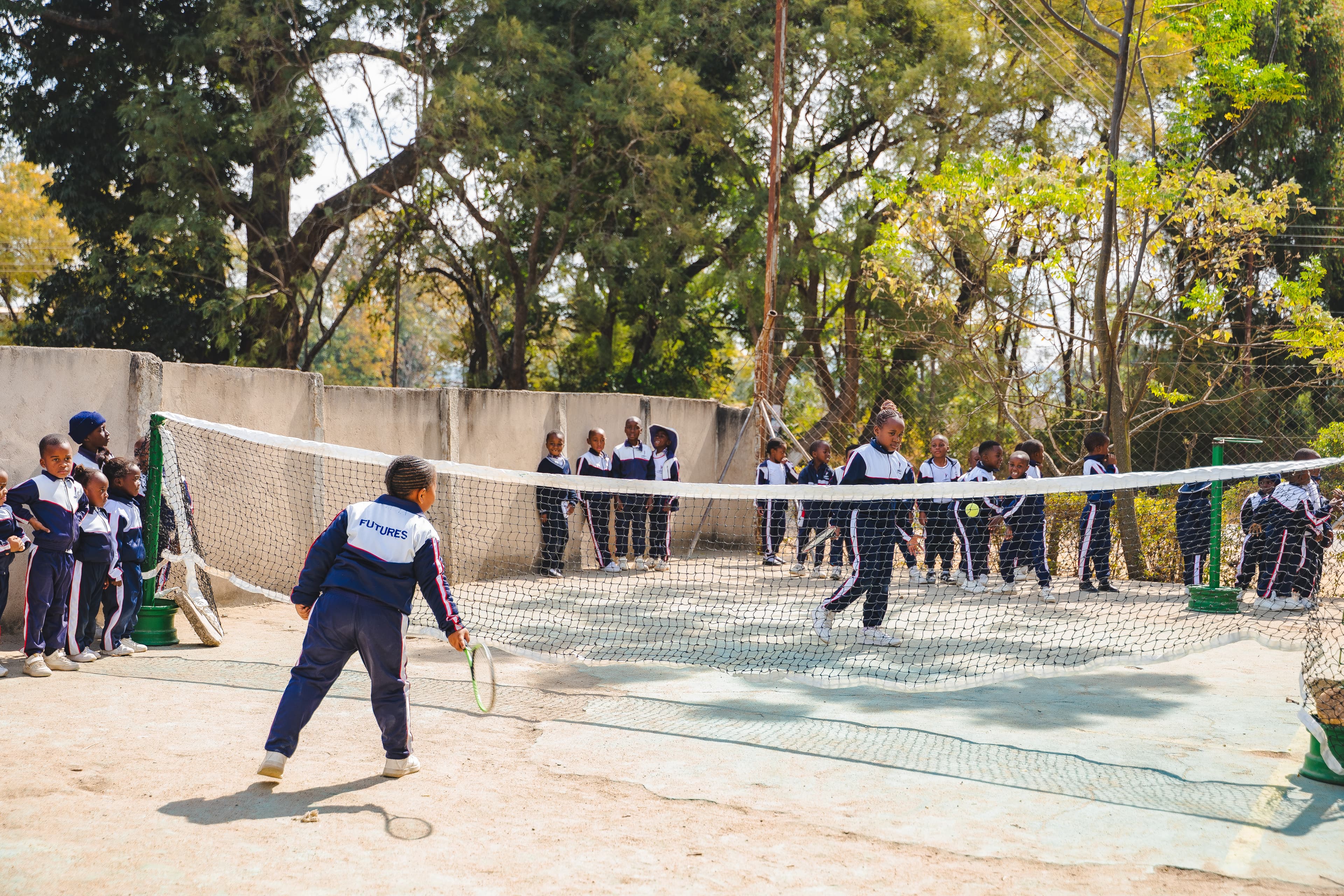Students playing tennis