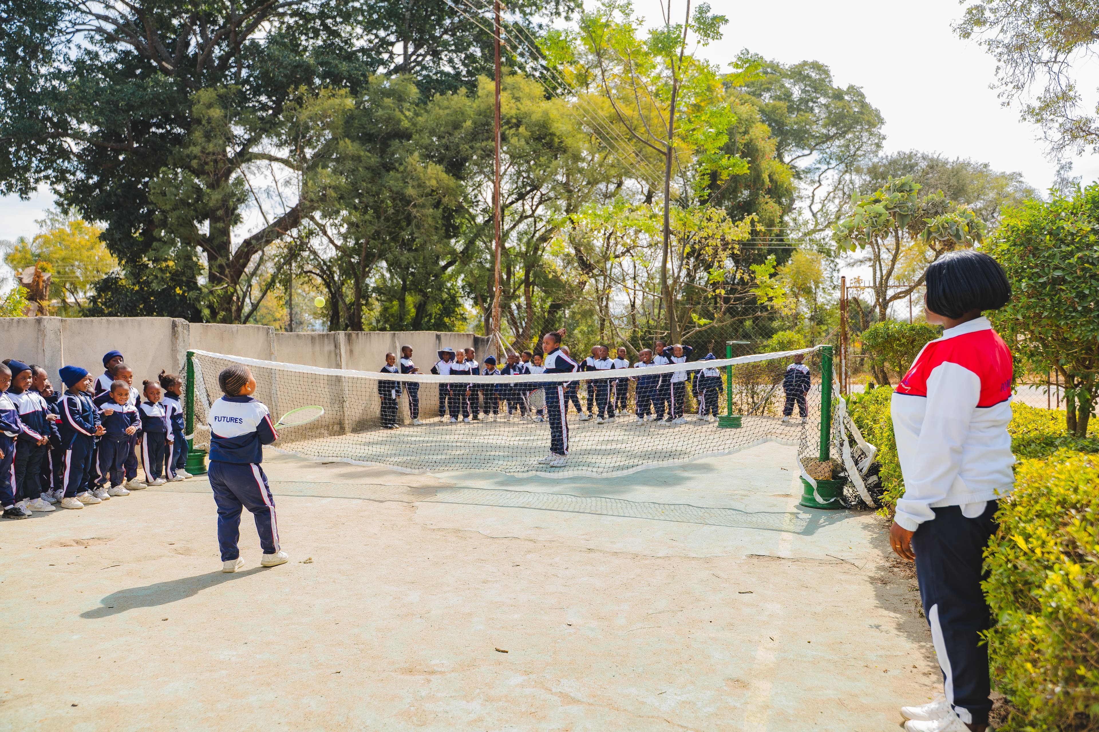 Students playing tennis