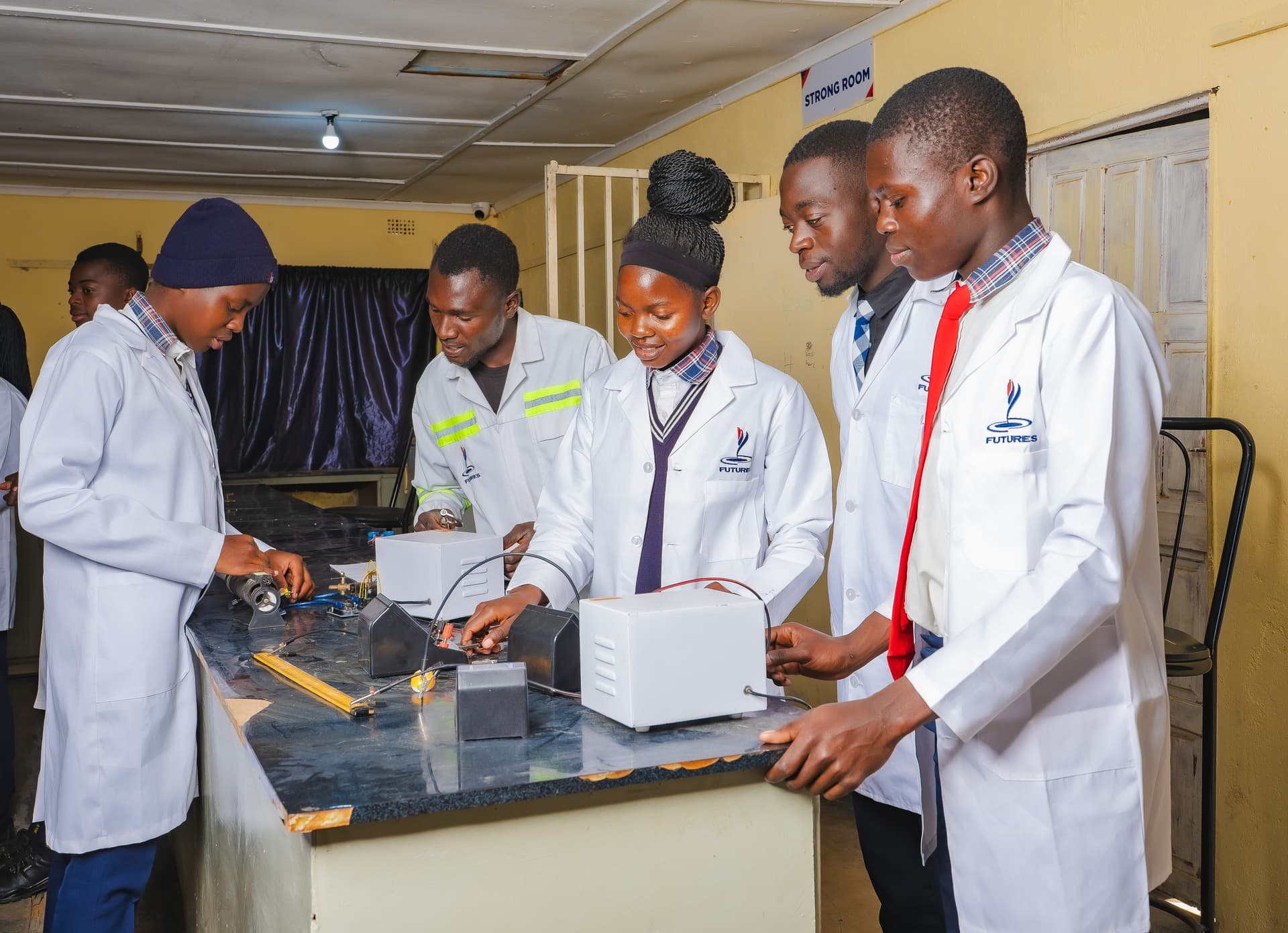 Science class working with lab equipment